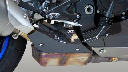 Carbon fiber heat shield for M4 exhaust, designed for 2015-2025 R1 models, with a sleek textured finish and precise fit.