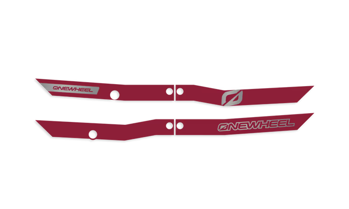 Onewheel XR Classic Recurve Rail Guards in burgundy protecting the side rails of the electric skateboard.