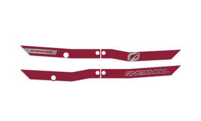 Onewheel XR Classic Recurve Rail Guards in burgundy protecting the side rails of the electric skateboard.