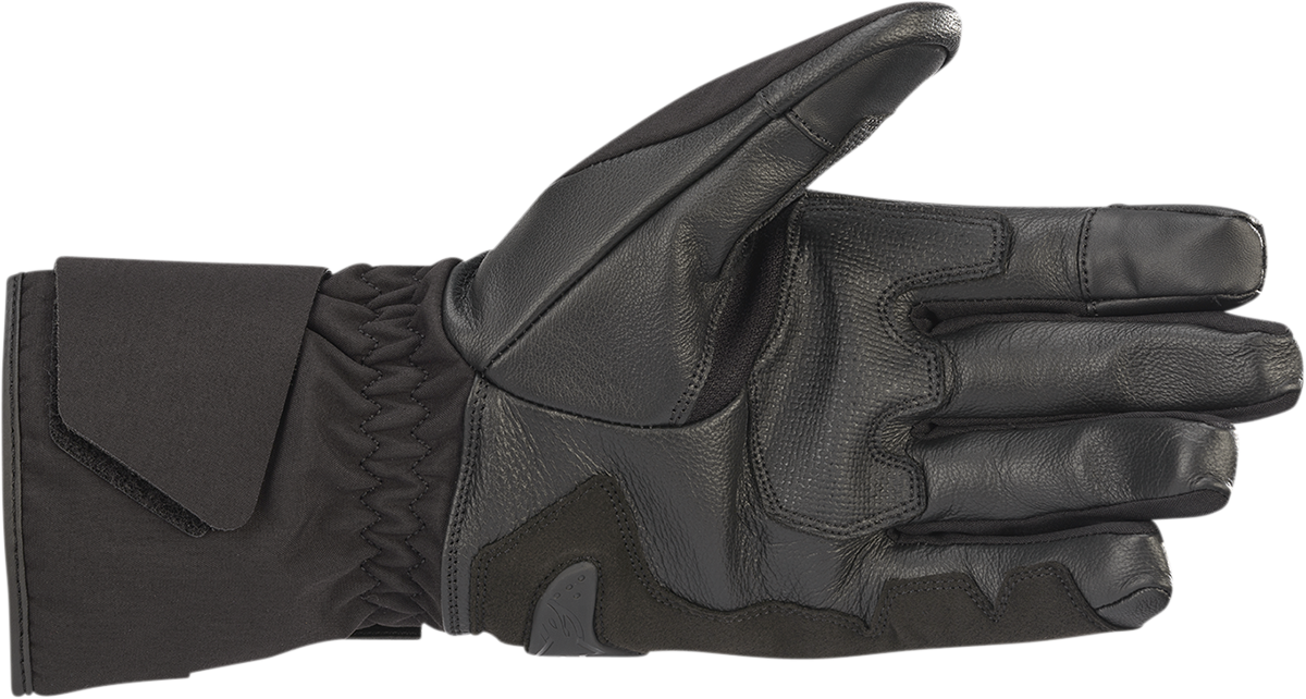 Alpinestars Apex V2 Drystar® motorcycle gloves in black, medium size, featuring protective armor and durable textile construction.