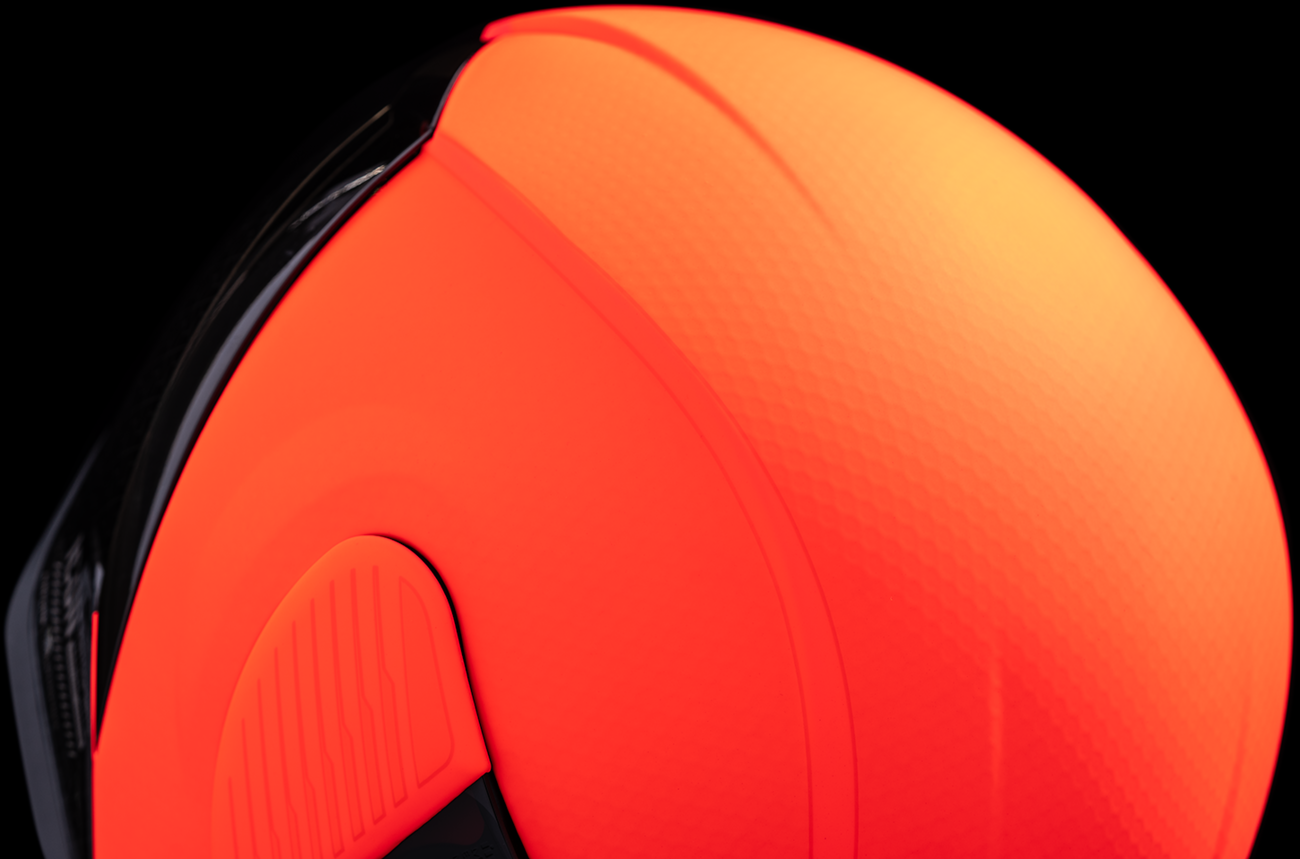 Red ICON Airform™ helmet with MIPS® technology in medium size, featuring a sleek design and adjustable straps.