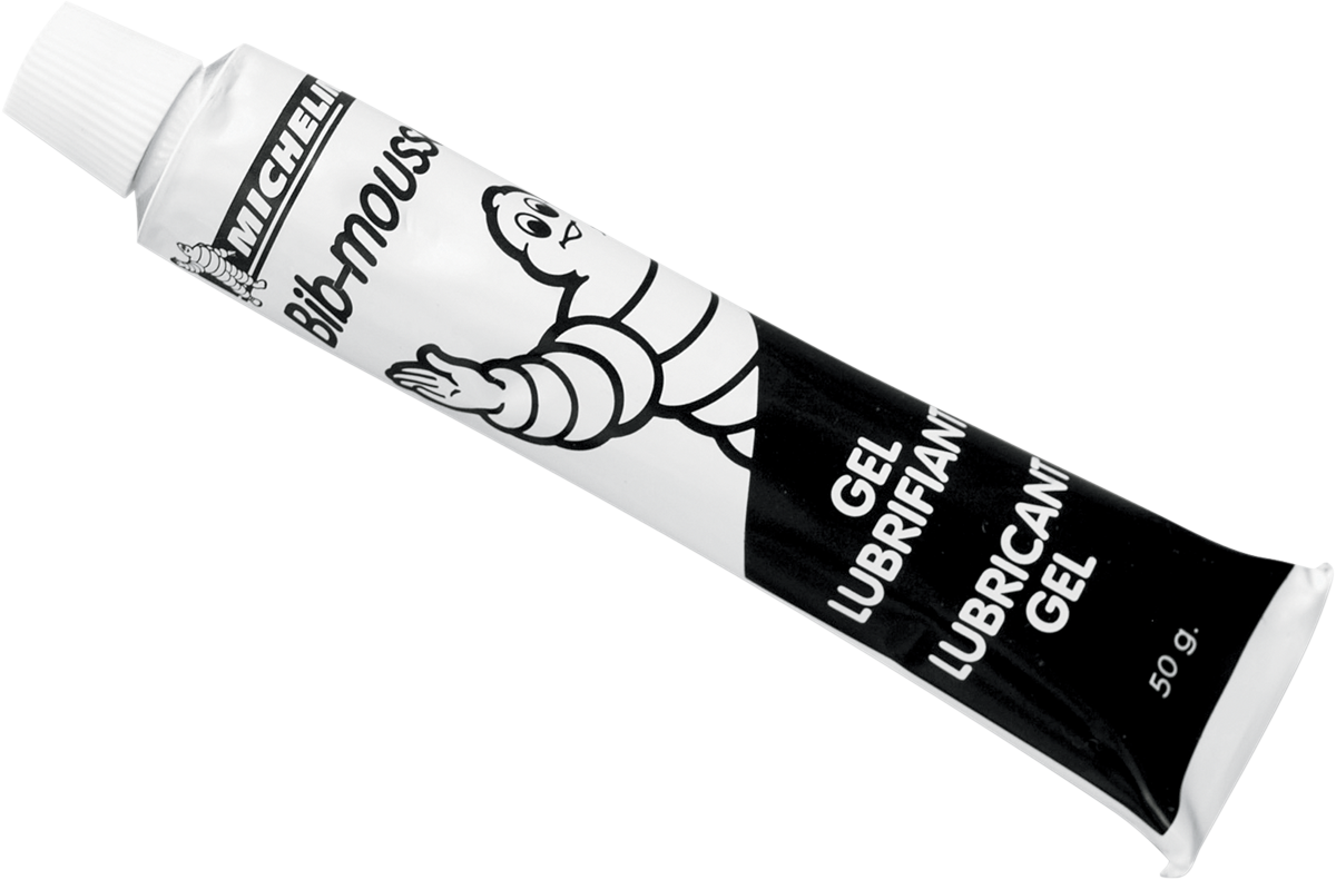 Michelin Bib Mousse Lube Gel tube, 50g, in a small, clear plastic tube with blue and white labeling, used for bicycle mousse lubrication.