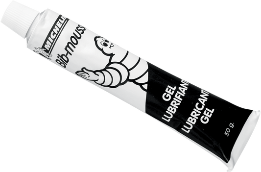 Michelin Bib Mousse Lube Gel tube, 50g, in a small, clear plastic tube with blue and white labeling, used for bicycle mousse lubrication.