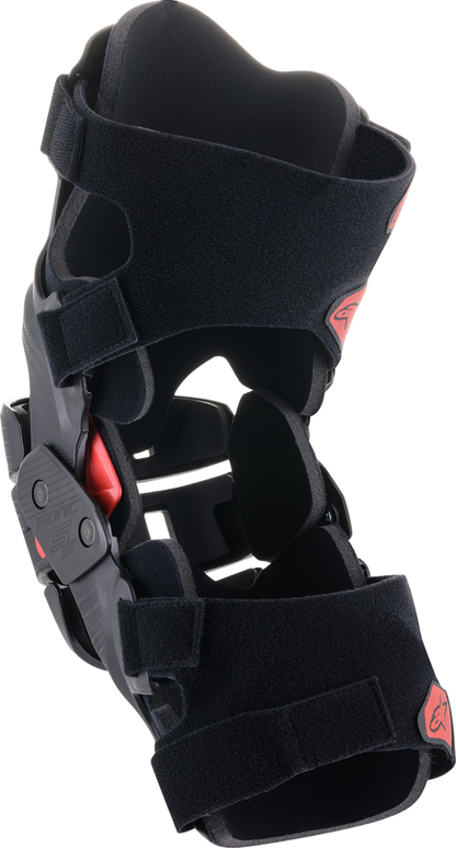 Alpinestars Youth Bionic 5S knee braces in black and red, designed for protection and support during motocross or biking.