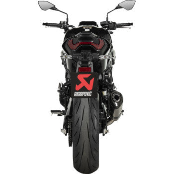 A Kawasaki Z900 2025 motorcycle with Bill's Exhausts titanium Akrapovic slip-on muffler installed, showcasing sleek exhaust design.