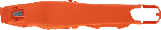 A close-up of orange ACERBIS Swing Arm Guards mounted on a motorcycle, showcasing their durable body protection design.