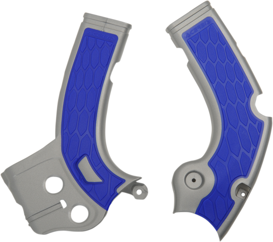 A silver and blue ACERBIS X-Grip motorcycle frame guards mounted on a bike, designed to protect the body.