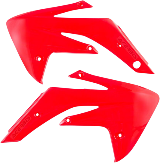 Red Acerbis radiator shrouds for body protection, designed for off-road or motocross bikes, with visible mounting points and aerodynamic shape.