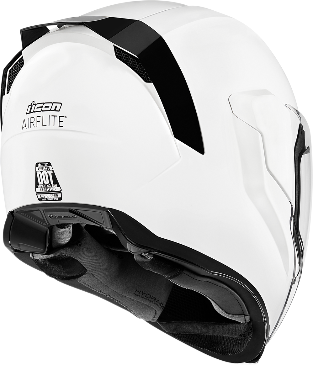 White ICON Airflite™ helmet with gloss finish, medium size, featuring aerodynamic design and clear visor for motorcycle riding.