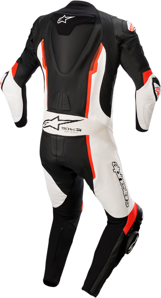 Alpinestars Missile v2 one-piece leather suit in black, white, and red fluorescent, displayed on a plain background.