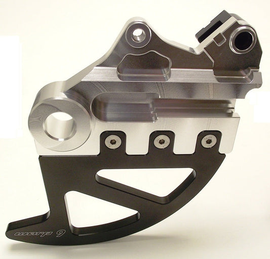 Rear disk guard for Suzuki DR650 by Warp9Racing, showing the protective metal cover from the backside.