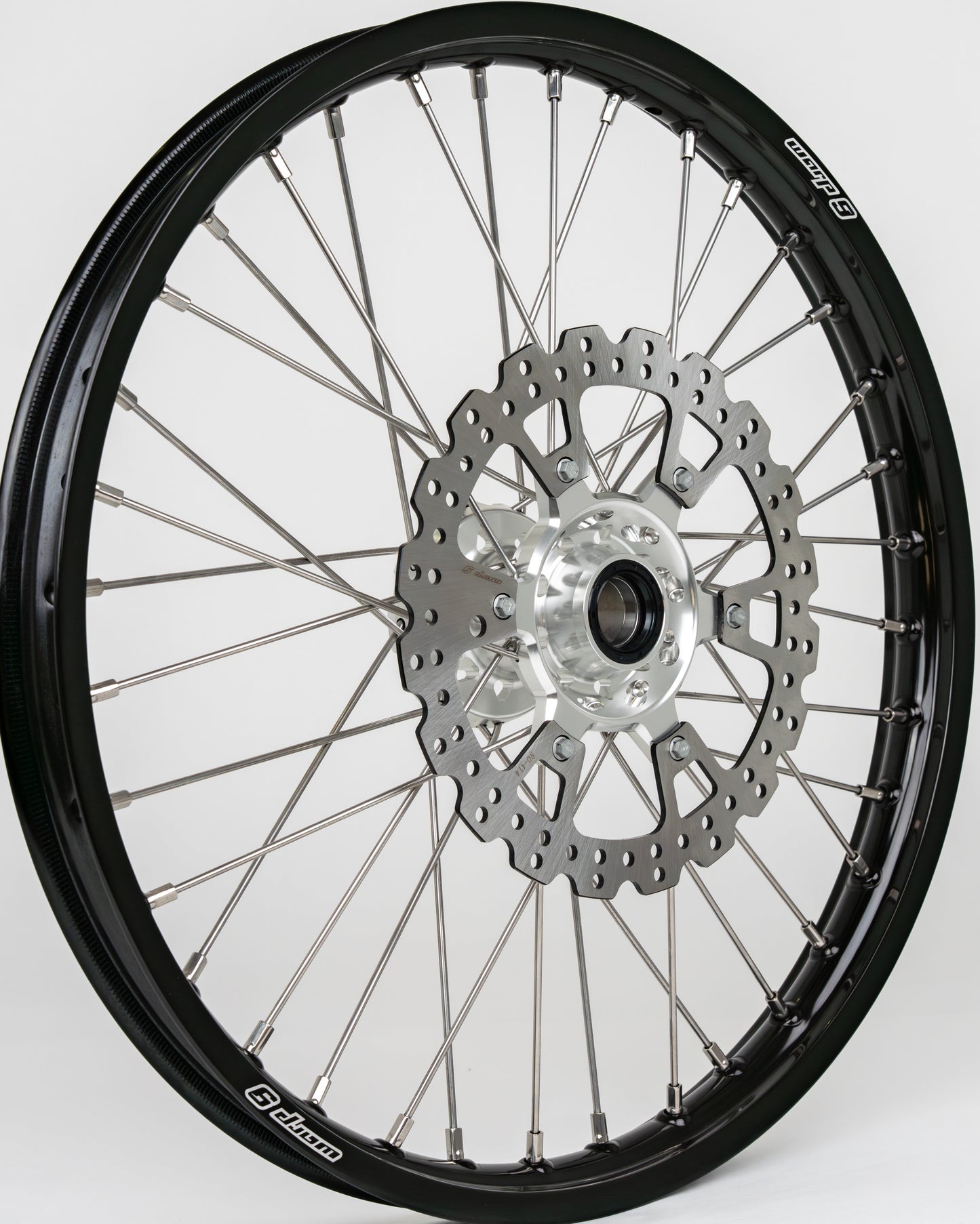 Warp9Racing KTM/Husqvarna/Gas Gas 21-inch front wheel showing the rim, spokes, and hub for off-road motorcycle use.
