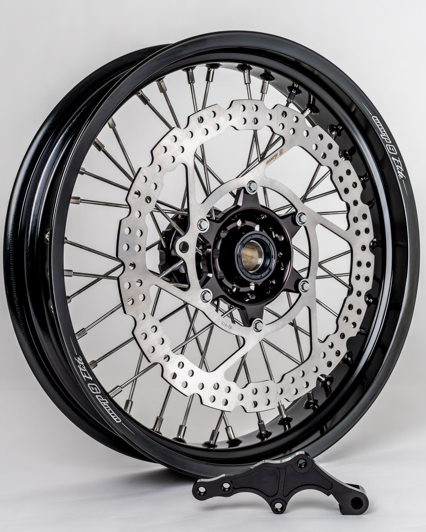 Warp9Racing early KTM front 17-inch wheel showing black rim and spokes, designed for KTM motorcycle front wheel replacement.