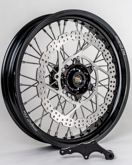 Warp9Racing early KTM front 17-inch wheel showing black rim and spokes, designed for KTM motorcycle front wheel replacement.