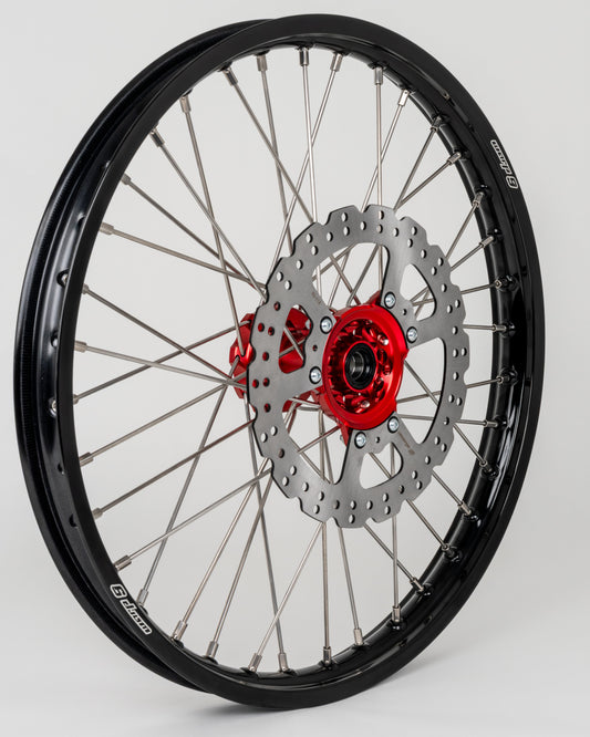 Warp9Racing Honda CR/CRF 21-inch front wheel showing spokes, rim, and hub for off-road motorcycle use.
