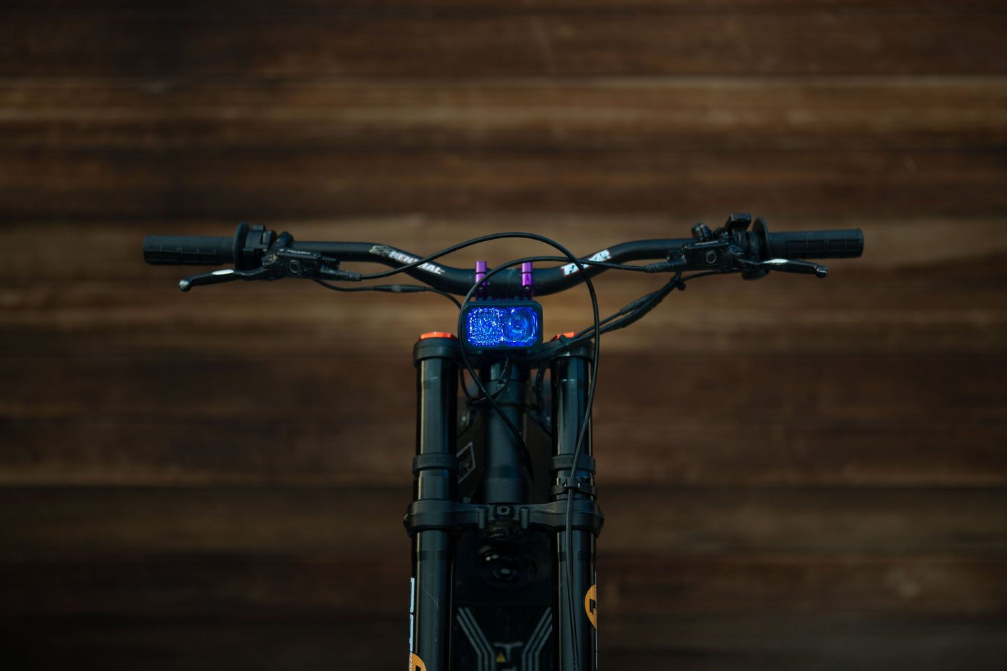 Warp9Racing V2 High-Output Headlight with W9 Mounting, showcasing durable construction and mounting hardware for optimal visibility.