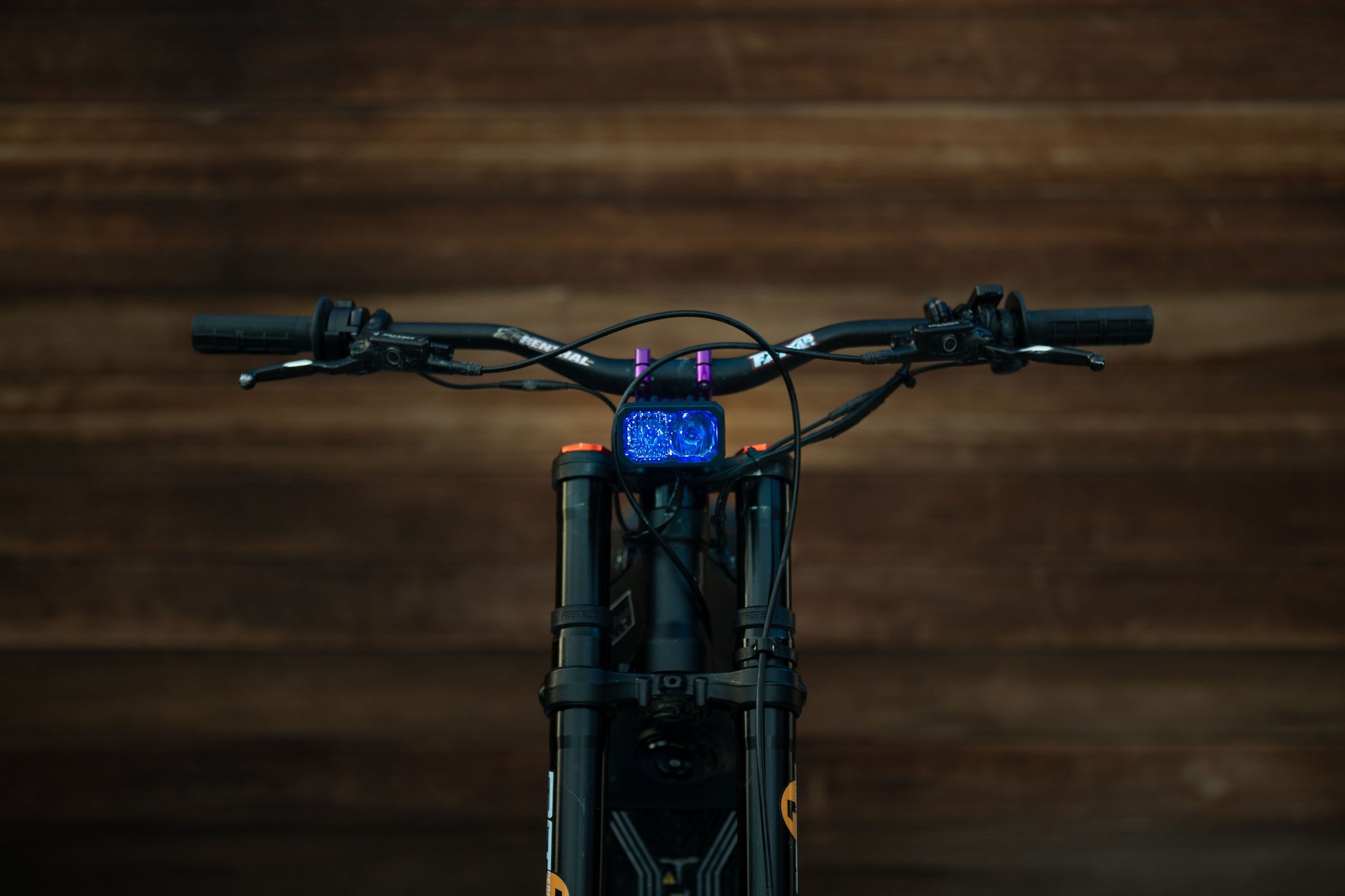 Warp9Racing V2 High-Output Headlight with W9 Mounting, showcasing durable construction and mounting hardware for optimal visibility.