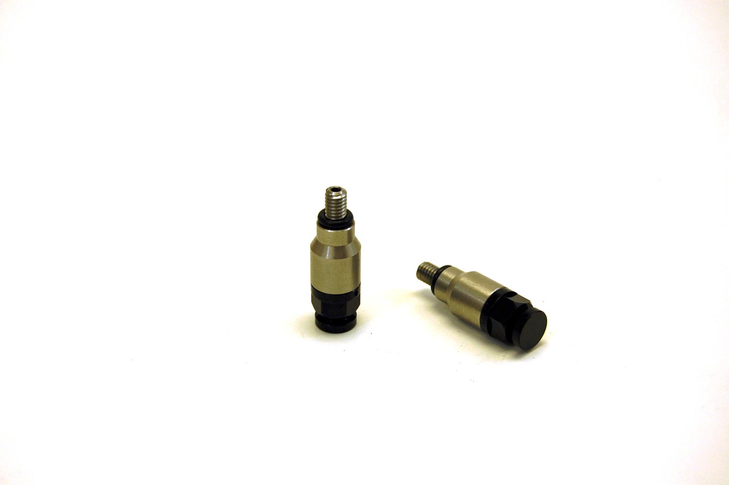 Warp9Racing KTM / WP Fork Bleeder valve for motorcycle suspension, shown installed on a fork with visible components.
