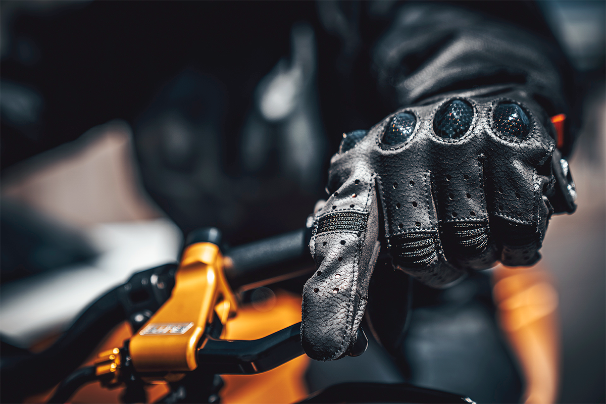 Black ICON Outdrive™ Gloves by Bill's Exhausts in small size, showing close-up of the textured palm and snug fit design.