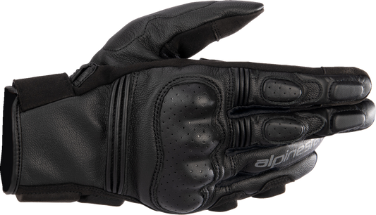 Alpinestars Phenom black motorcycle gloves in medium size, showing the textured palm and protective knuckles.