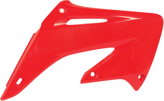 Red ACERBIS radiator shrouds for motorcycle body, featuring brand-specific design and vibrant color detail.