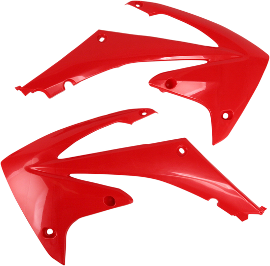 Red Acerbis radiator shrouds for motorcycle body protection, designed for durability and style.