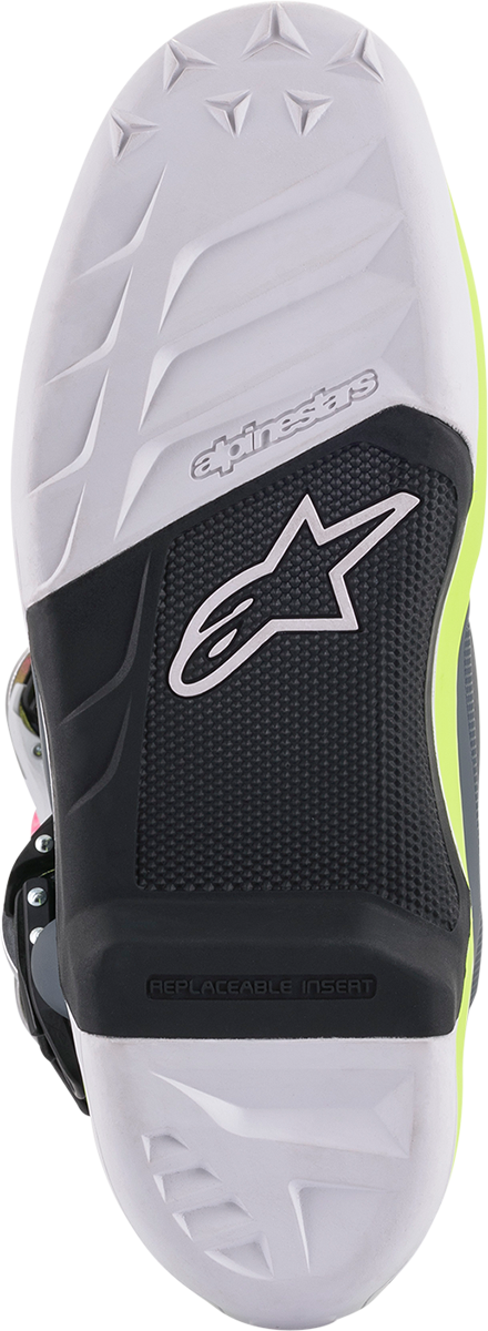 Alpinestars Tech 7 motorcycle boots in black, pink, white, and yellow, size US 10, featuring protective design and bold color accents.