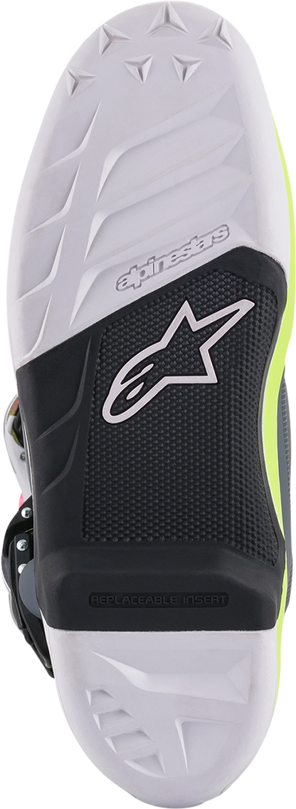 Alpinestars Tech 7 motorcycle boots in black, pink, white, and yellow, size US 10, featuring protective design and bold color accents.
