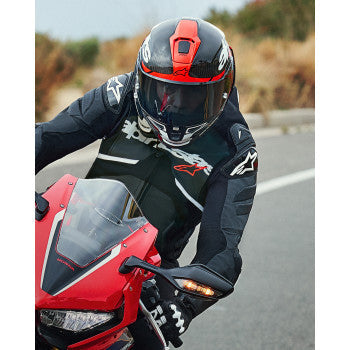Alpinestars Supertech R10 racing helmet in carbon, red, and white with open face design, small size, on a neutral background.