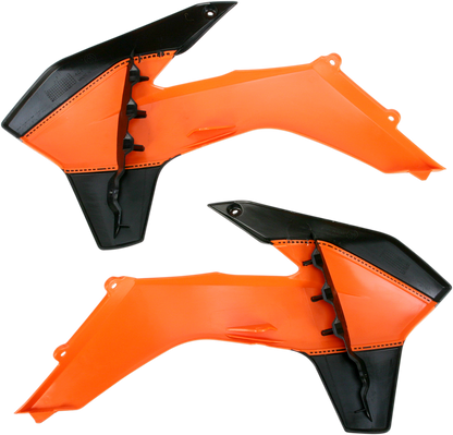 Acerbis radiator shrouds in orange and black for motocross bikes, designed to protect and enhance the bike's body appearance.