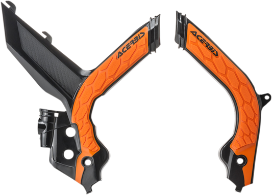 A set of ACERBIS X-Grip black and orange motorcycle frame guards with textured surface and mounting points for body protection.