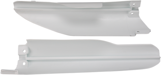 White ACERBIS lower fork covers for RM 125/250 1999-2003 motorcycle, designed for durability and optimal fit.