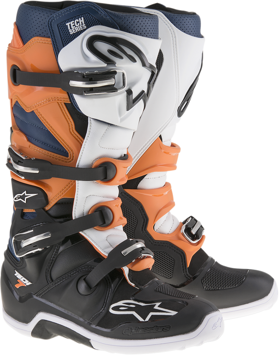 Alpinestars Tech 7 motorcycle boots in black, orange, and white with US size 5, featuring sturdy design and protective features.