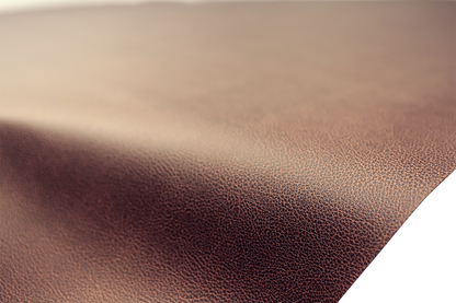 Brown SADDLEMEN Carbon Seat Cover for motorcycle seat, measuring 54x36 inches, with textured carbon design.