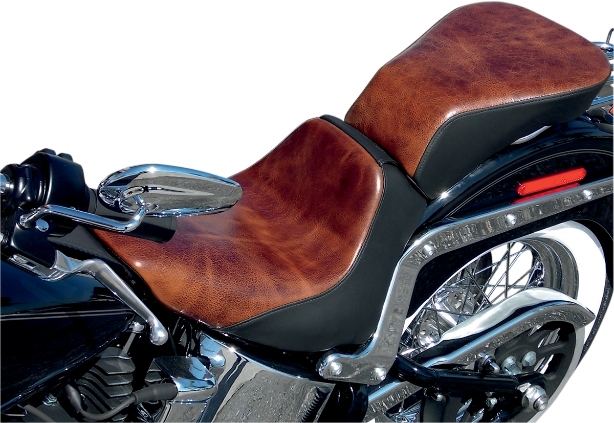 Bill's Exhausts SADDLEMEN Lariat Seat for FLSTN/C motorcycle, showing black leather seat with detailed stitching and contoured design.