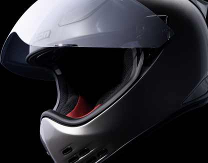 Silver ICON Domain™ Helmet Cornelius style in large size, featuring sleek helmet design with detailed graphics and vent openings.