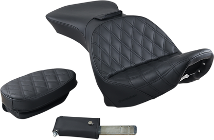 Black SADDLEMEN Explorer motorcycle seat with backrest and lattice stitching, designed for FLSTS models, by Bill's Exhausts.