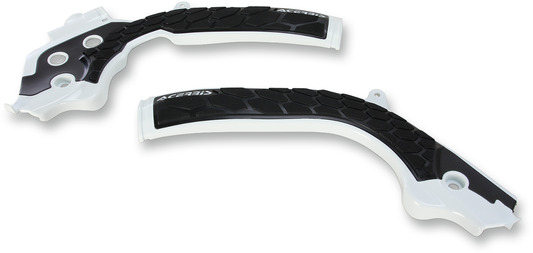 Acerbis X-Grip frame guards in white and black for motorcycle body protection, shown installed on a bike frame.