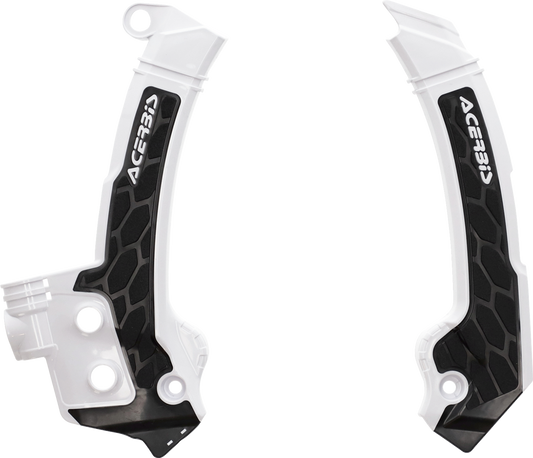 Acerbis X-Grip motorcycle frame guards in black and white mounted on a bike frame, providing protection and style.