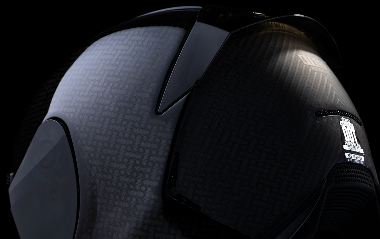 Black ICON Airframe Pro™ helmet in 3XL size with carbon shell design, featuring sleek visor and aerodynamic shape.