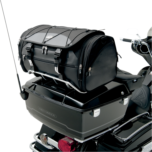 Bill's Exhausts SADDLEMEN TR3300DE Deluxe Rack Bag seat mounted on motorcycle with straps and storage compartments.
