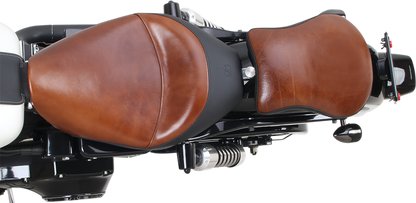 Contoured SADDLEMEN Lariat Pad seat for motorcycles, featuring a 9-inch design with padding for rider comfort.