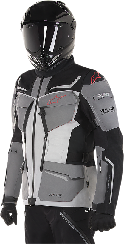 Alpinestars Revenant jacket in black, gray, and red, small size, featuring sporty design and branding, displayed on a plain background.