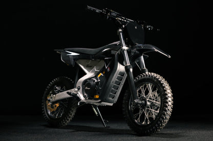 Greenger G2 electric dirt bike for kids, 50cc equivalent, with red frame, handlebars, and off-road tires for outdoor riding.