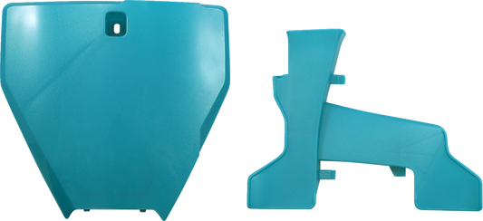 A teal metallic ACERBIS front number plate mounted on a motorcycle body, showcasing the sleek design and vibrant color.