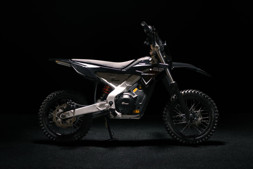 Greenger G2 electric dirt bike for kids, 50cc equivalent, with sturdy frame and off-road tires, suitable for young riders.