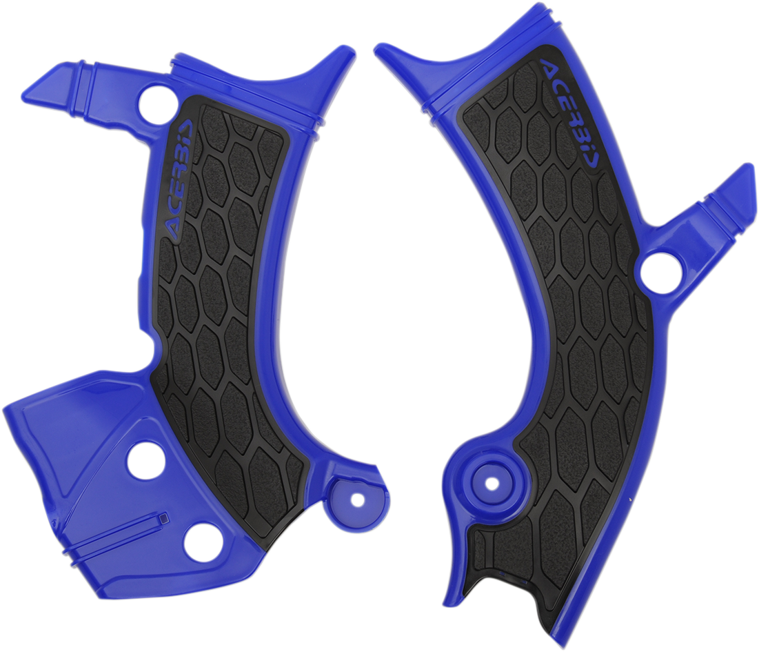 Acerbis X-Grip motorcycle frame guards in blue and black mounted on a bike frame, providing protection and style.