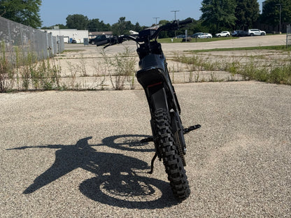 E Ride Pro SR electric dirt bike with 25KW motor, 70MPH speed, and 72V Samsung battery, shown outdoors on dirt trail.