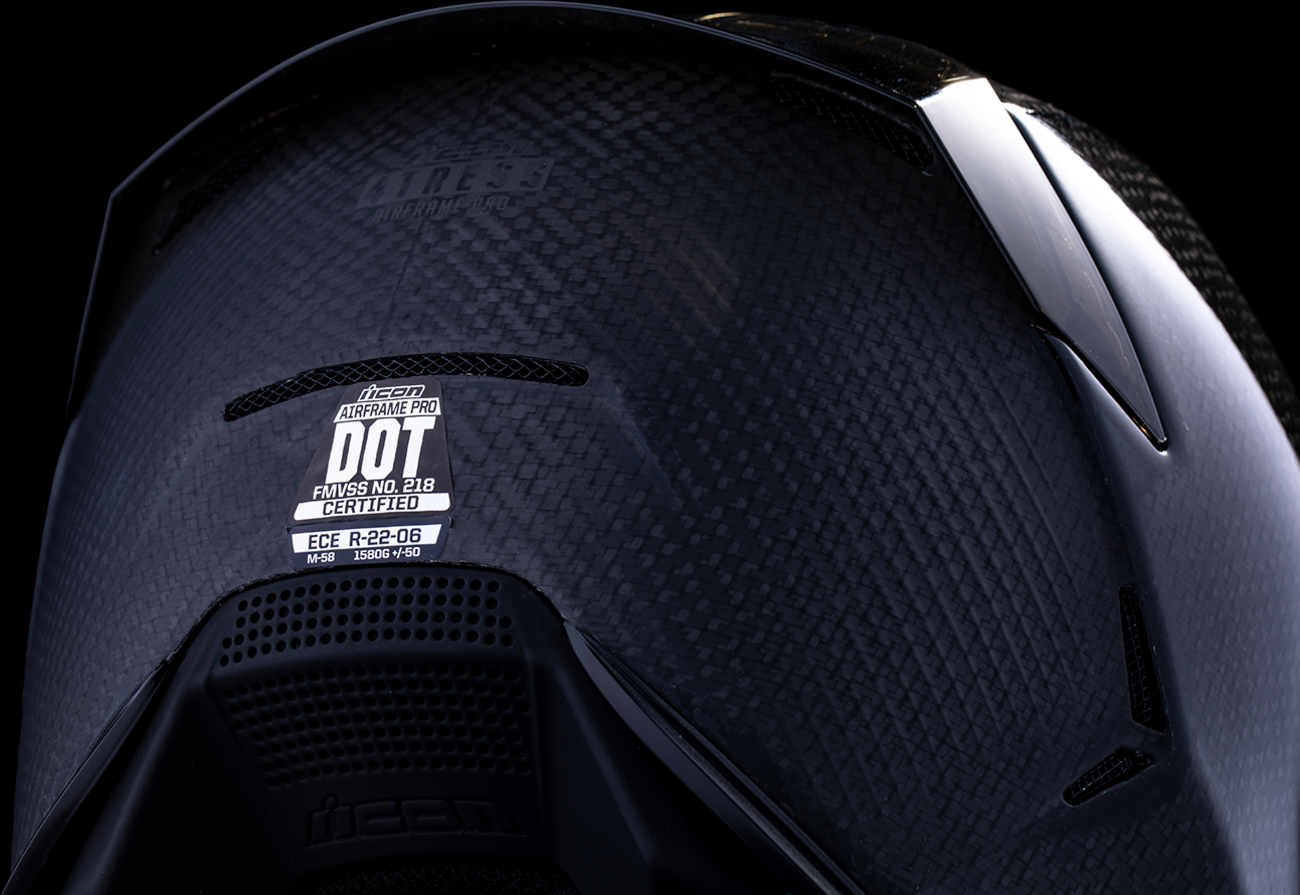 Black ICON Airframe Pro™ helmet in 3XL size with carbon fiber shell, featuring sleek design and ventilation openings.