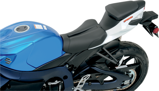 Black Saddlemens Gel Channel Track Carbon Fiber Sport Seat for GSXR 600/750 motorcycle, showing sleek carbon fiber finish and streamlined design.